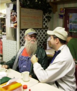 Don Mellon and Bob Connell talk on the air over breakfast at P.J.'s Rainbow Cafe on The Square