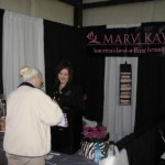 Pamela Connell with Mary Kay welcomes folks to the Travel Show (Handheld) Pamela Connell with Mary Kay welcomes folks to the Travel Show