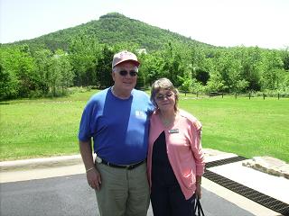 will-poses-with-marilyn-wright-executive-director-of-the-heber-springs-area-chamber-look-at-sugarloaf-mountain-in-the-back-ground