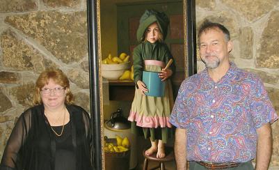 Artist Tim Tyler (on right) has an art exhibit at the NCA Gallery located at Indian Hills Country Club in Fairfield Bay. He stands next to one of his life-like oil paintings "Canning Pears". On the left is Connie Hood, President of North Central Arkansas Artist League, which sponsored an artist reception and a two-day oil painting workshop Sept. 7 and 8. 