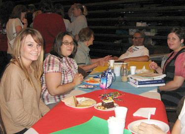 Guests enjoy lunch and cake at the BCM Birthday Party at UACCB