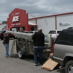 Folks bring trailers to load all the deals