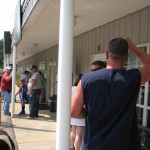 Folks enjoy getting out of the sun on the porch