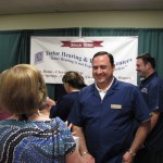 Dr Taylor from Taylor Hearing and Balance Centers talks with folks