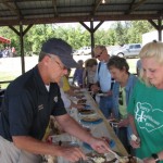 Shiriff Marty Moss of Cleburne County helps serve