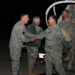 Maj. Gen. William Wofford (left) adjutant general of the Arkansas National Guard greets a plane full of Arkansas, Georgia and Mississippi National Guard Soldiers who returned home late Tuesday after completing a yearlong deployment in Iraq.