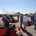 Folks talk, lunch being served under the big top