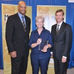 Renie Taylor, Administrator at Stone County Medical Center, accepts the Most Wired-Small and Rural Award for SCMC from (left) Paul E. McRae, Senior Vice President of Healthcare Emerging Technologies at AT&T and (right) Walter Reid, McKesson Provider Technologies’ Vice President of product strategy and marketing for Paragon.