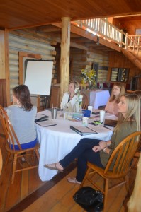 Leadership participants Jennifer Corter (City of Batesville) (far left), Novella Humphrey (Southside Public Schools) (left), Beth Bruce (UACCB) (right), and Magen Griffin (Life Strategies Counseling, Inc.) prepare for a team activity.