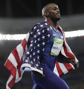 United States' Jeff Henderson celebrates winning the gold medal in the men's long jump during the athletics competitions of the 2016 Summer Olympics at the Olympic stadium in Rio de Janeiro, Brazil, Saturday, Aug. 13, 2016. (AP Photo/David Goldman)