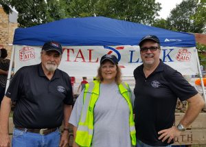 Jimmie Edwards with Timeless 106.1 KFFB, Kathleen Ruminer - Special Events Coordinator with Vital Link and an EMT, and Bob Connell owner of KFFB take time our for a picture. 