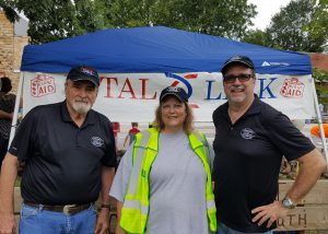 Jimmie Edwards with Timeless 106.1 KFFB, Kathleen Ruminer - Special Events Coordinator with Vital Link and an EMT, and Bob Connell owner of KFFB take time our for a picture.