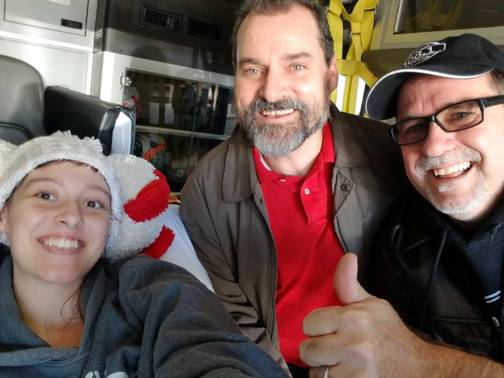 Moriah"the Brave" Moore, Earl Moore (Arrow's Cafe) and Bob Connell with Timeless 106.1 KFFB doing a live broadcast from the ambulance taking her home.